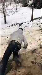 Kid Sleds Down A Dirt Road