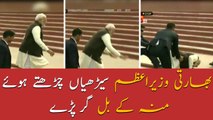 Indian PM Narendra Modi falls on stairs