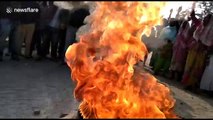 Tyres burned and police pelted with stones by protesters in Golaghat, India