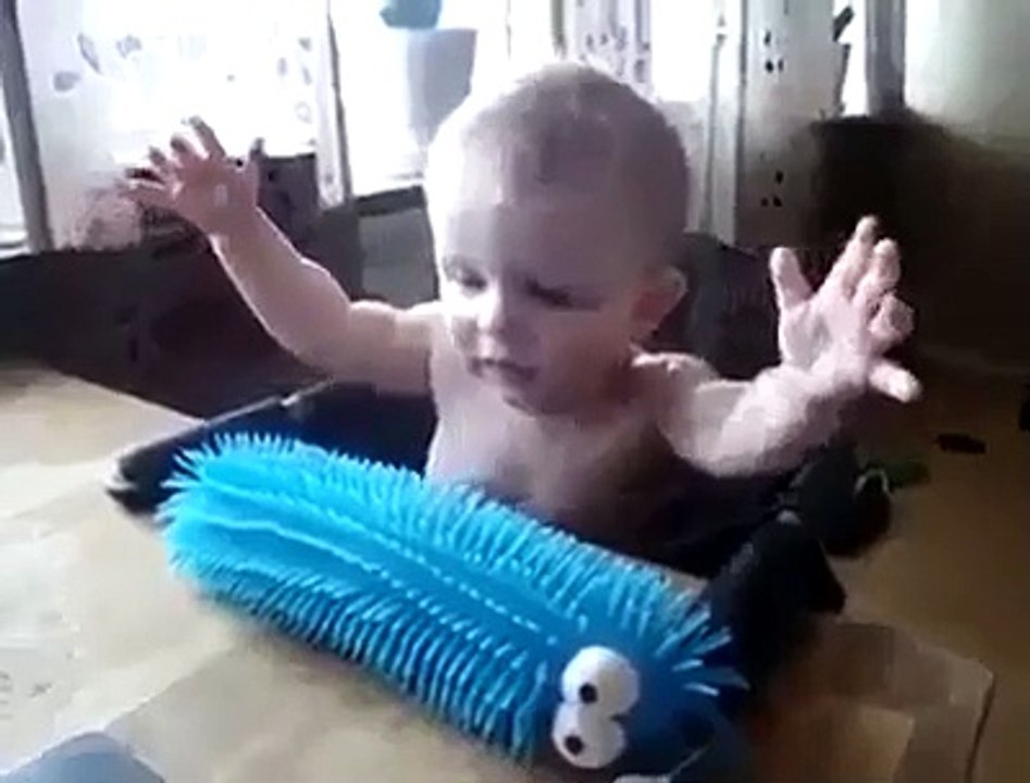 Baby doesn't want to touch weird looking toy...!