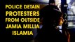 Police detain protesters from outside Jamia Millia Islamia