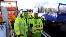 Derek and Ryan from Class One Traffic Management bring some Christmas cheer to delayed commuters travelling between Falkirk and Grangemouth