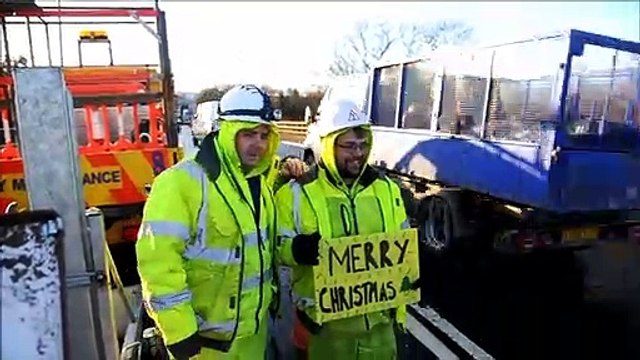 Derek and Ryan from Class One Traffic Management bring some Christmas cheer to delayed commuters travelling between Falkirk and Grangemouth