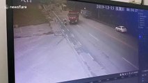 Chinese biker miraculously survives after being run over by truck