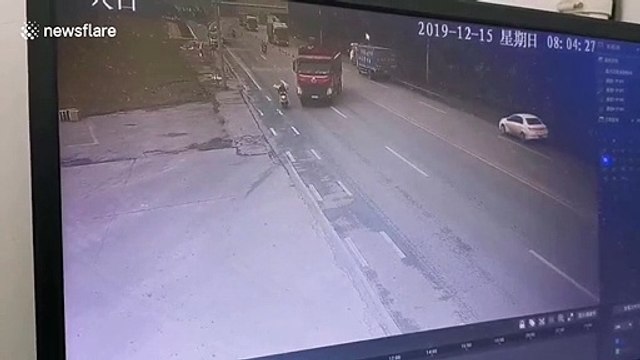 Chinese biker miraculously survives after being run over by truck