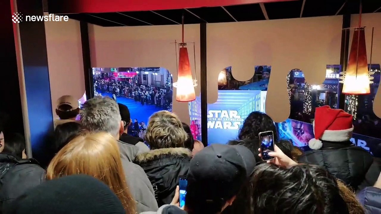 Determined fans crowd to watch 'Star Wars' UK premiere from window of nearby Burger King