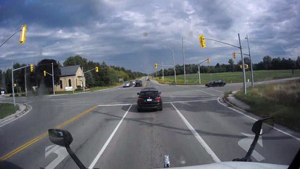 Close Call as Tractor Trailer Runs Red Light