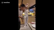 Waiters perform energetic 'noodle dance' at hot pot restaurant in Vietnam