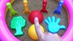 Toy shovels and sand molds _ Hand and colored balls _ Play on outdoor playground pool with sand
