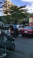 Motorcyclist Gives Car a Much-Needed Nudge