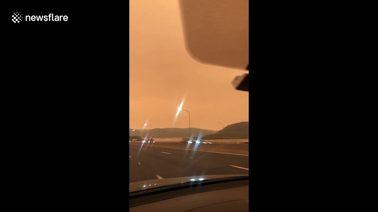 Australian bush fires turn New South Wales sky orange