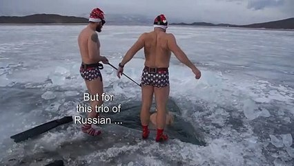 Russian ice divers put up New Year's tree in frozen Lake Baikal