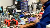 Italian engineer repairing toys for needy children