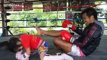 Cute but deadly: Thai boxing prodigy practices with father