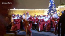 Scores of Santas race around St Petersburg square