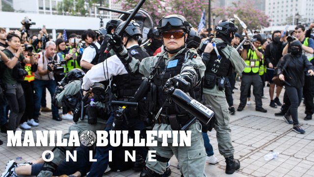 Riot police break up Hong Kong rally for China's Uighurs