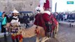 Santa Claus visits Jerusalem on camelback