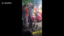 Three students found dead after being trapped in flooded cave in Indonesia