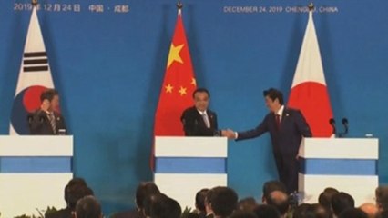 Li, Abe y Moon apuestan por solución pacífica para Corea y acuerdo comercial