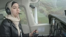 A Syrian refugee reaches for the skies