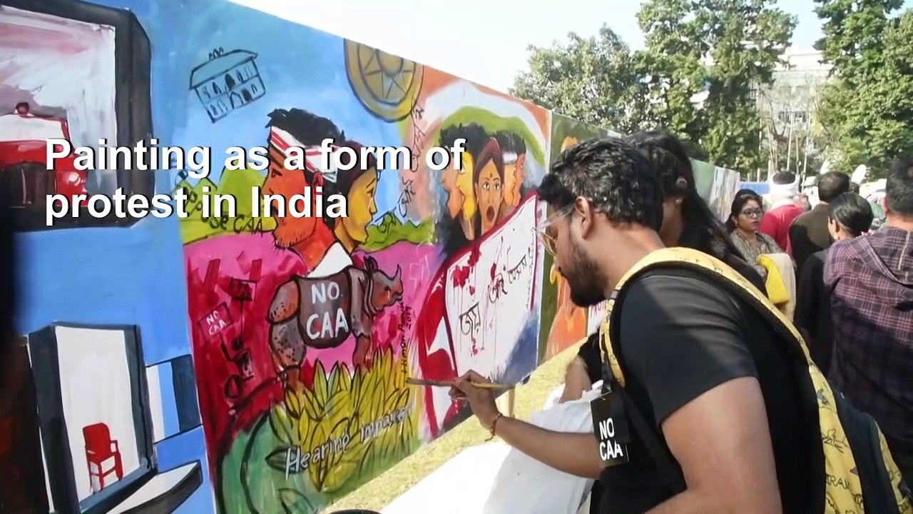 Indian protesters paint angry messages against new law
