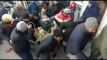 Rangers rescue ibex injured in suspected snow leopard attack