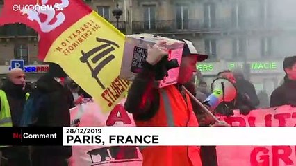 French pension strikers and Gilets Jaunes march together on 24th day of action