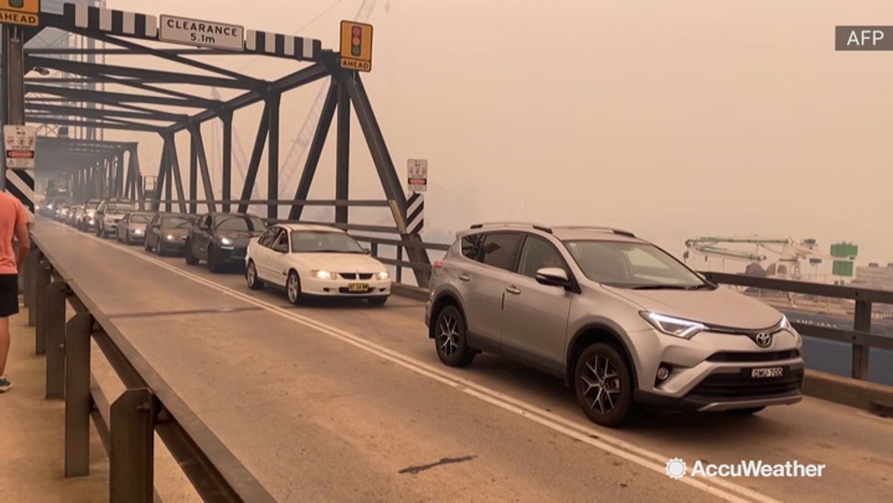 Traffic backed up as thousands flee wildfires
