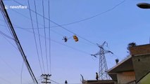 Chinese paraglider rescued after parachute becomes tangled on high-voltage power lines