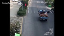 Boy narrowly escapes being run over by minibus in China