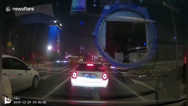 Giant pipe loaded on truck hits car and drags it forward several metres in China