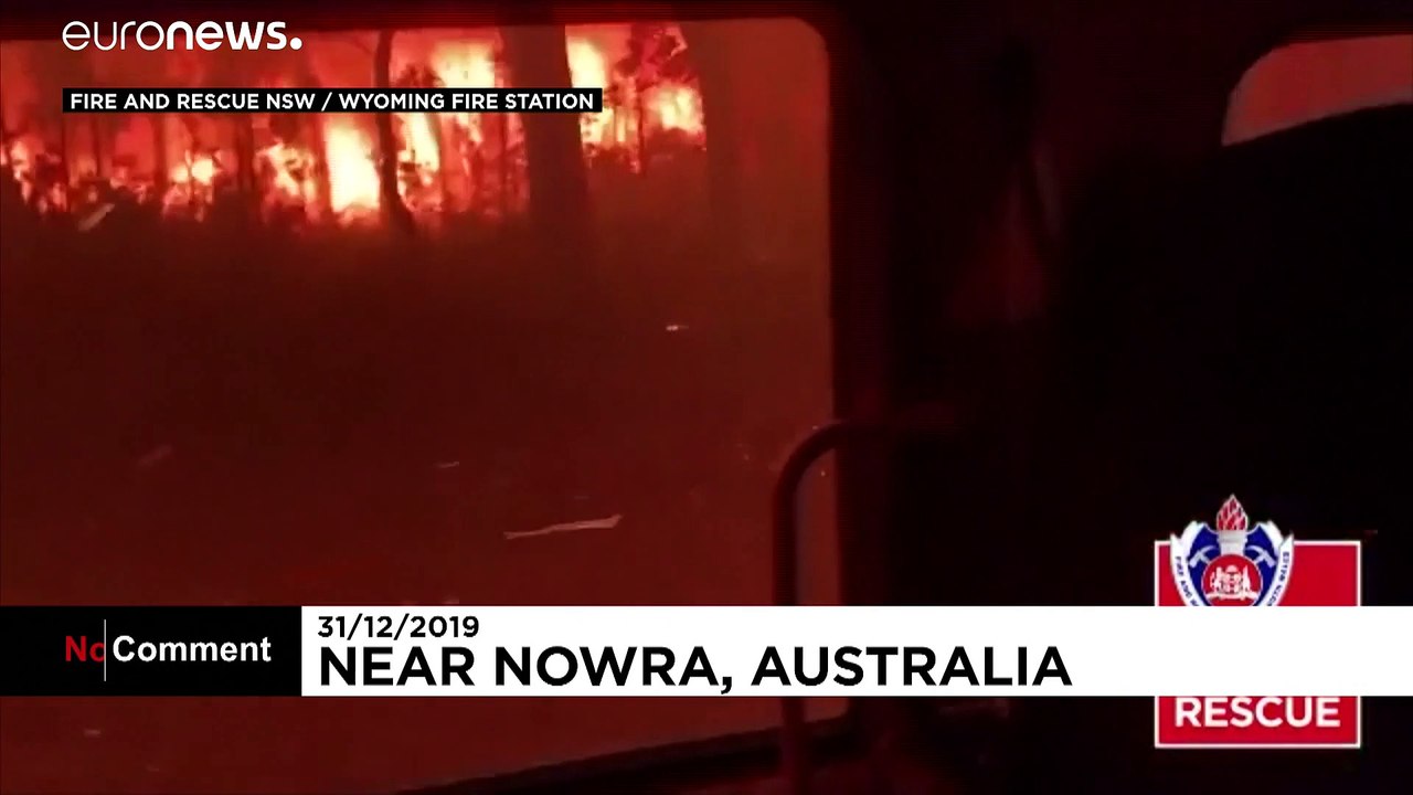 Terrifying moment as Australian firefighters drive through flames