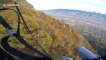 Aerial daredevil parachutes just inches above treetops speed-flying down French mountain