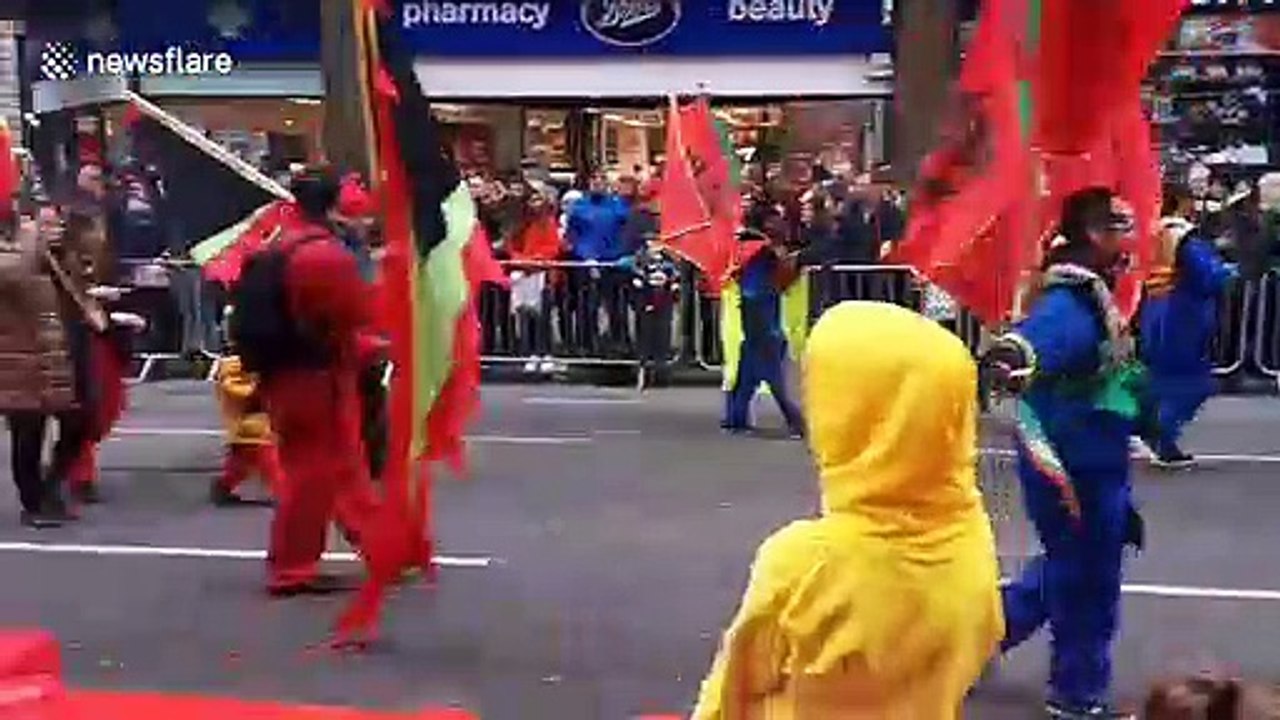 London New Year's Parade held in Piccadilly with costumes, dinosaurs and giant balloons