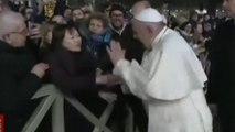 Pope apologises for slapping hand of woman who grabbed him
