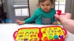 Genevieve Teaches Kids with Alphabet Puzzle and Rainbow Candy-