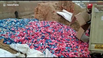 Mystery trucks caught dumping thousands of unopened condoms in vacant land in north India