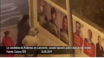 La candidata de Podemos en Lanzarote, cazada tapando publicidad de los rivales