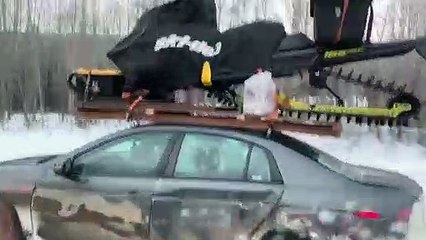 Cheap Car Carries Expensive Snowmobile