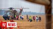 Fire conditions ease but evacuations continue in Australia
