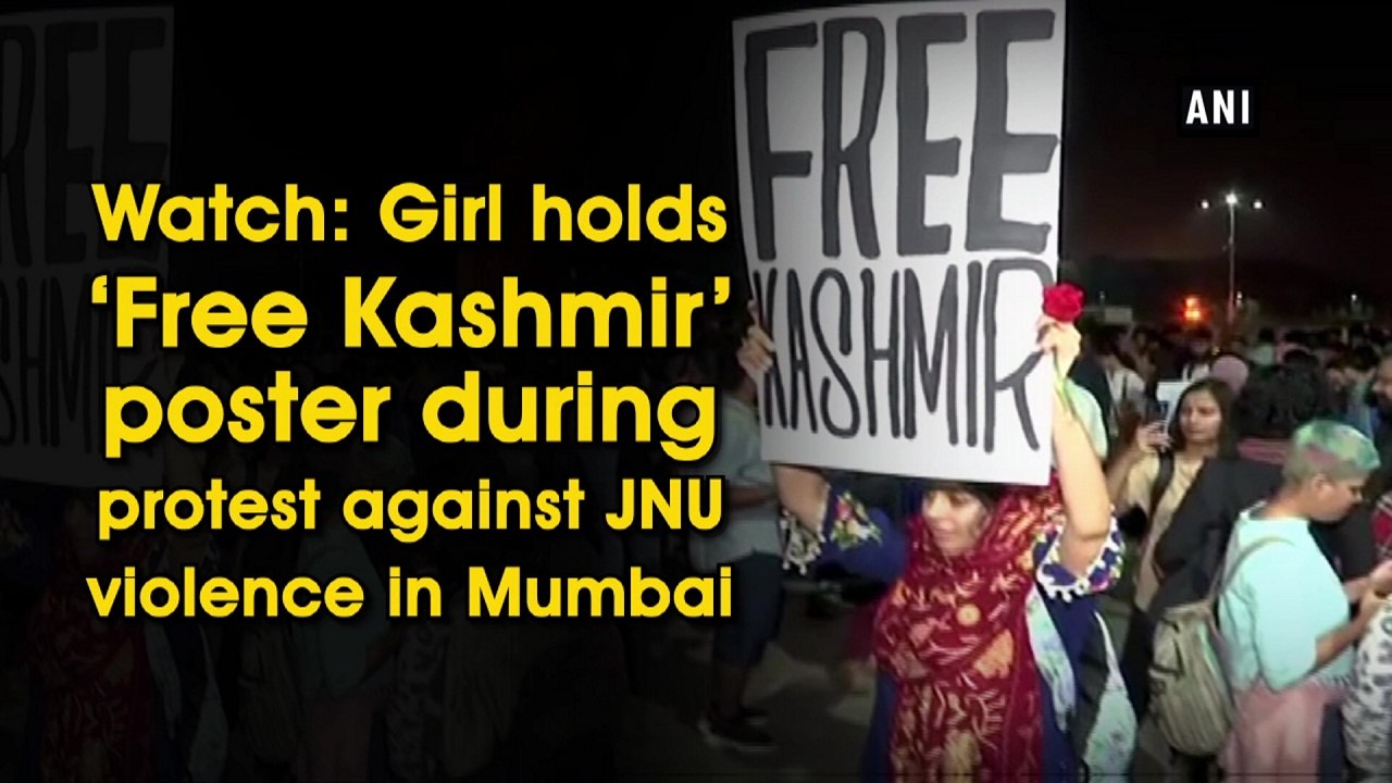 Girl holds ‘Free Kashmir’ poster during protest against JNU violence in Mumbai