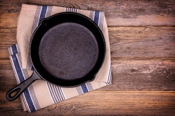 Alton Brown Has An Entire Wall of Cast Iron Pans in His Marietta Kitchen