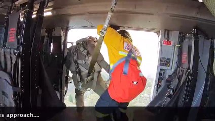 A Royal Navy helicopter pilot has helped evacuate people trapped by the bush fires in Australia.