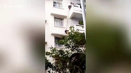 Chinese grandma lowers seven-year-old grandson two floors BY ROPE to rescue her cat