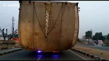 Massively overloaded tractors take up two lanes on north Indian highway