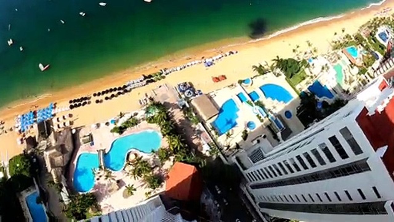 Lucky Base Jumper Gets Caught on Balcony