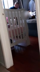 Dad Struggles to Change Baby's Diaper