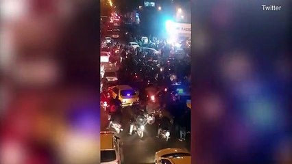 Download Video: Tehran locals are shot with rubber bullets as they watch protests