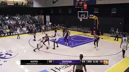 Keldon Johnson rises to block the shot