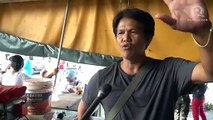 Vendors brave imminent Taal eruption to sell the last of their goods